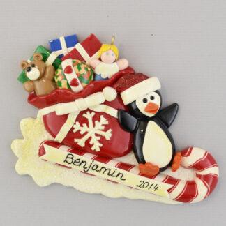 Penguin on Toboggan with Bag of Toys personalized Christmas Ornaments