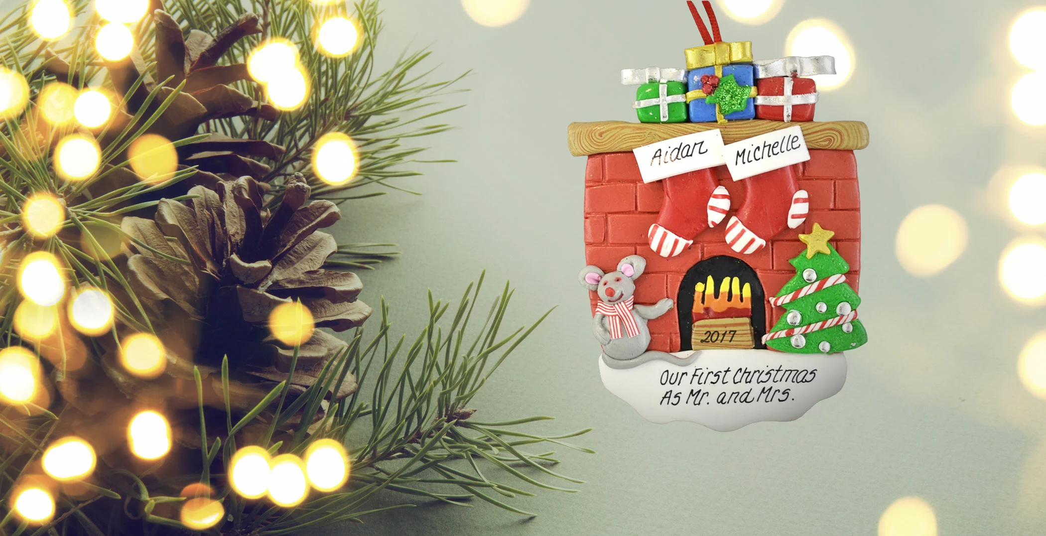 Personalized christmas fireplace ornament hanging on holiday tree.
