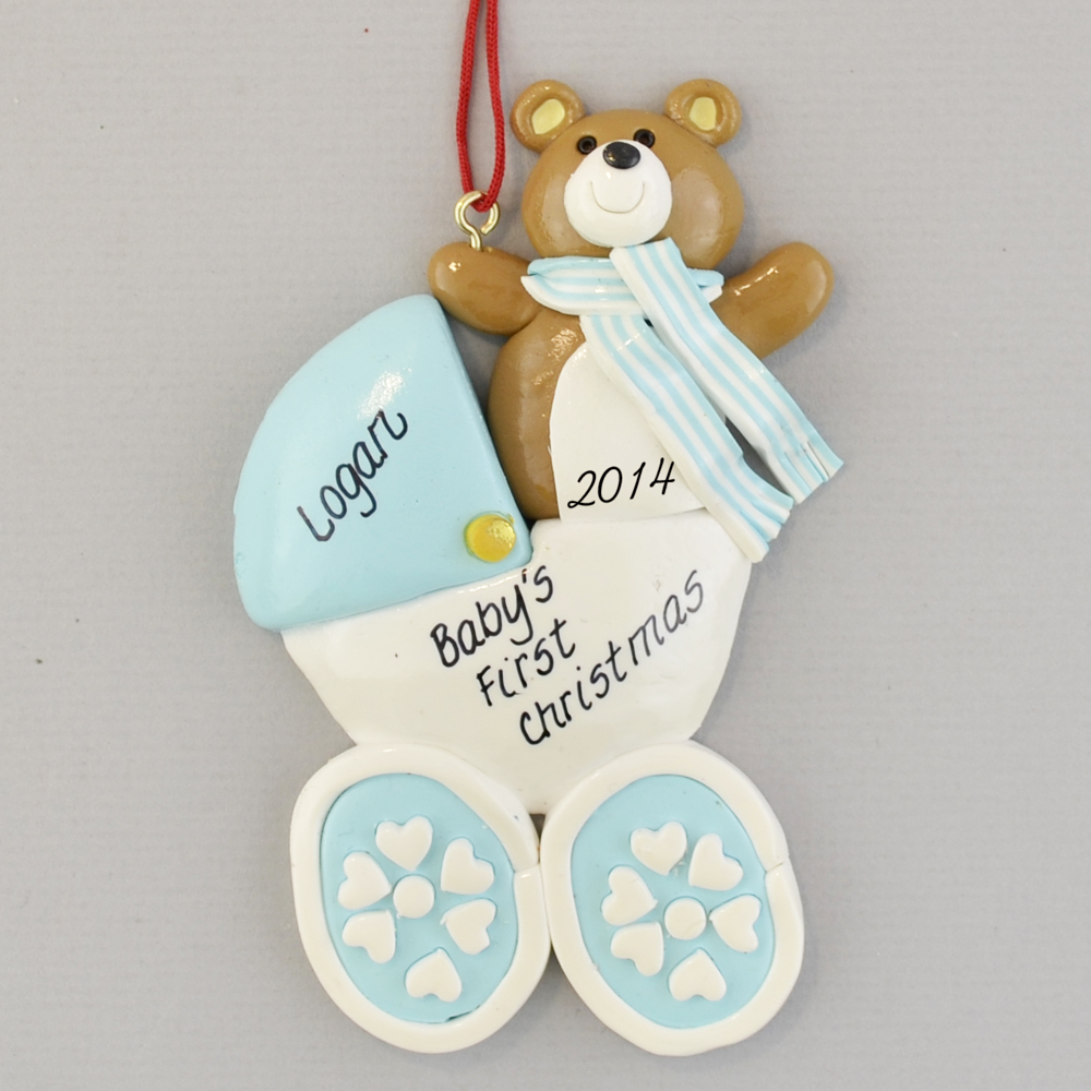 clay ornament consisting of bear in stroller with customized wording on it